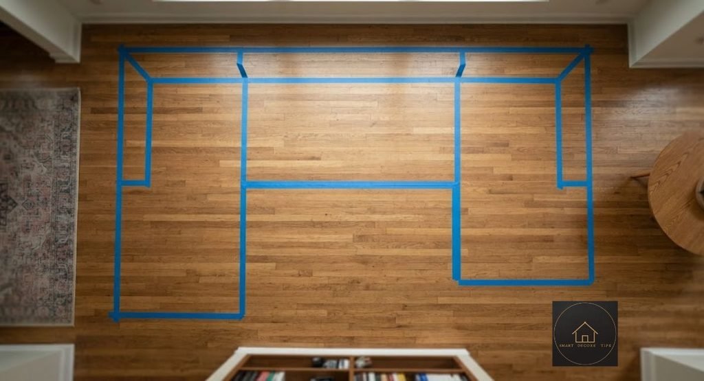 Left-Facing vs Right-Facing Sectional: How to Tell Painter's tape outline of a sectional with the chaise taped on the left side of a living room floor